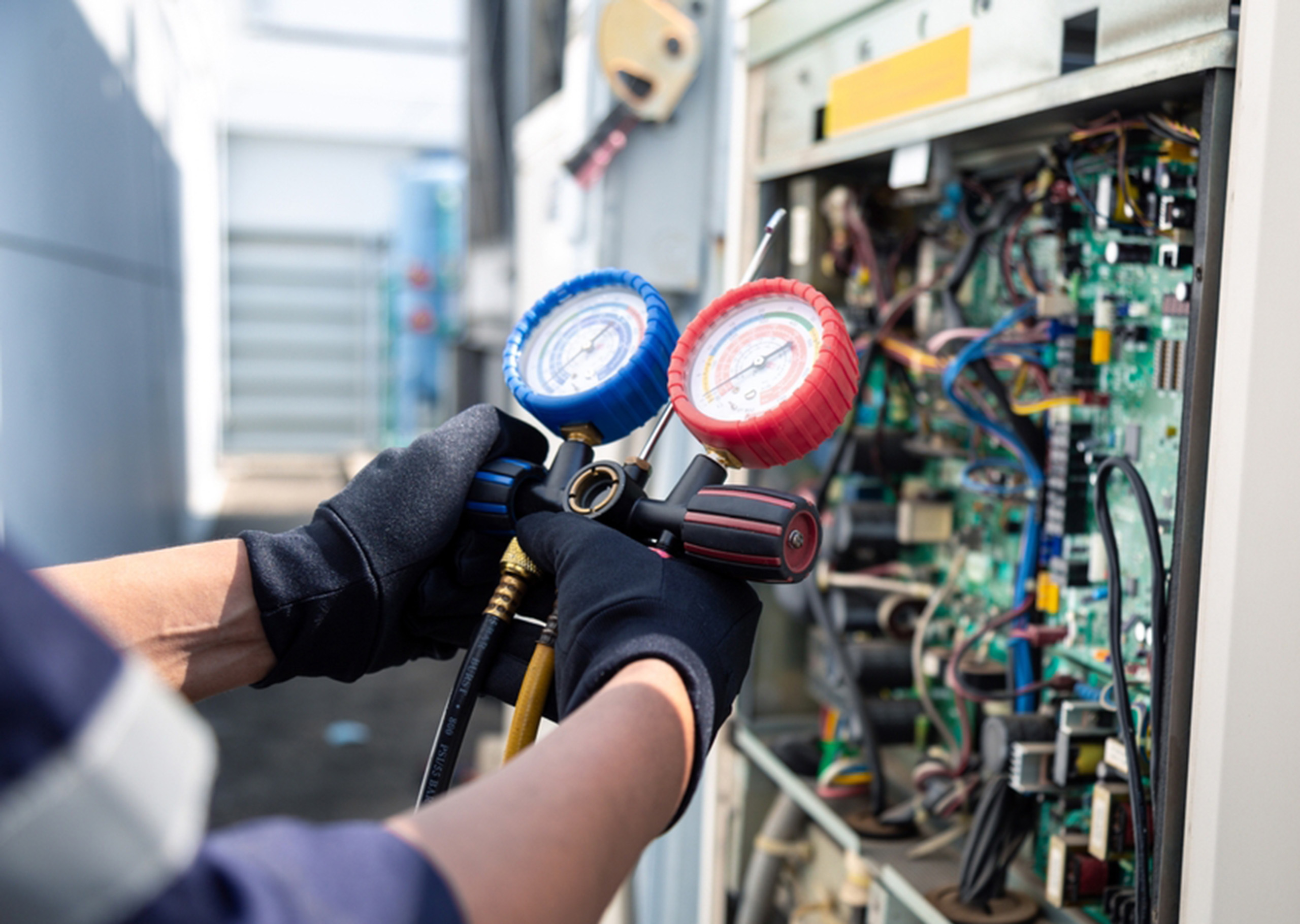 Worker wearing low voltage gloves